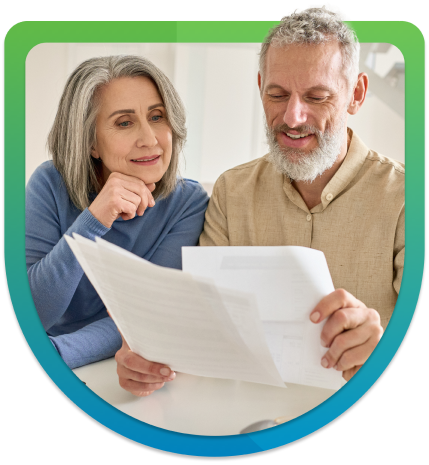 Elderly couple looking at mortgage form