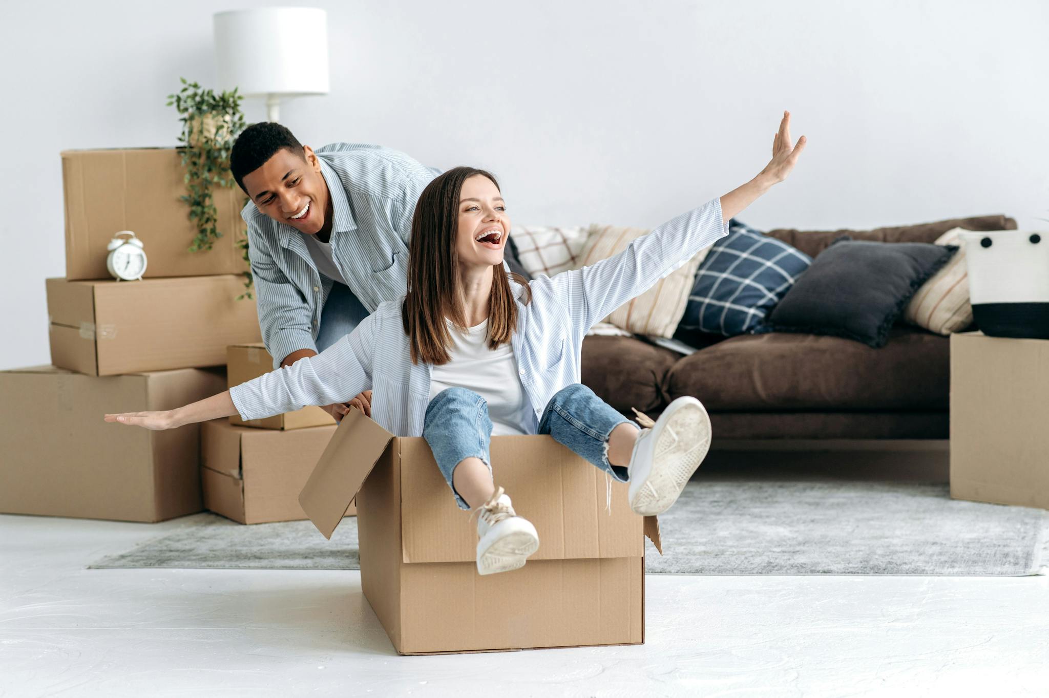 Image of Couple sat in boxes